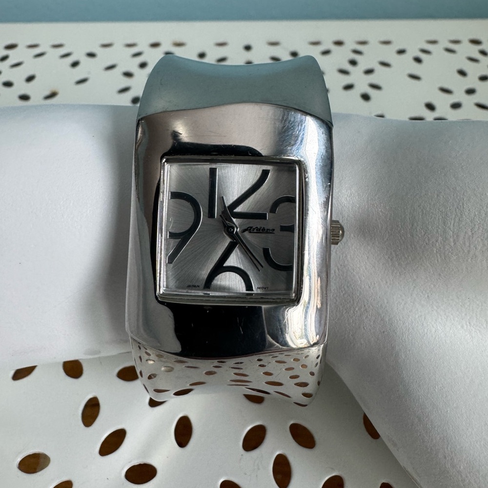 Silver toned Rectangular bangle Wristwatch, Ardene.
